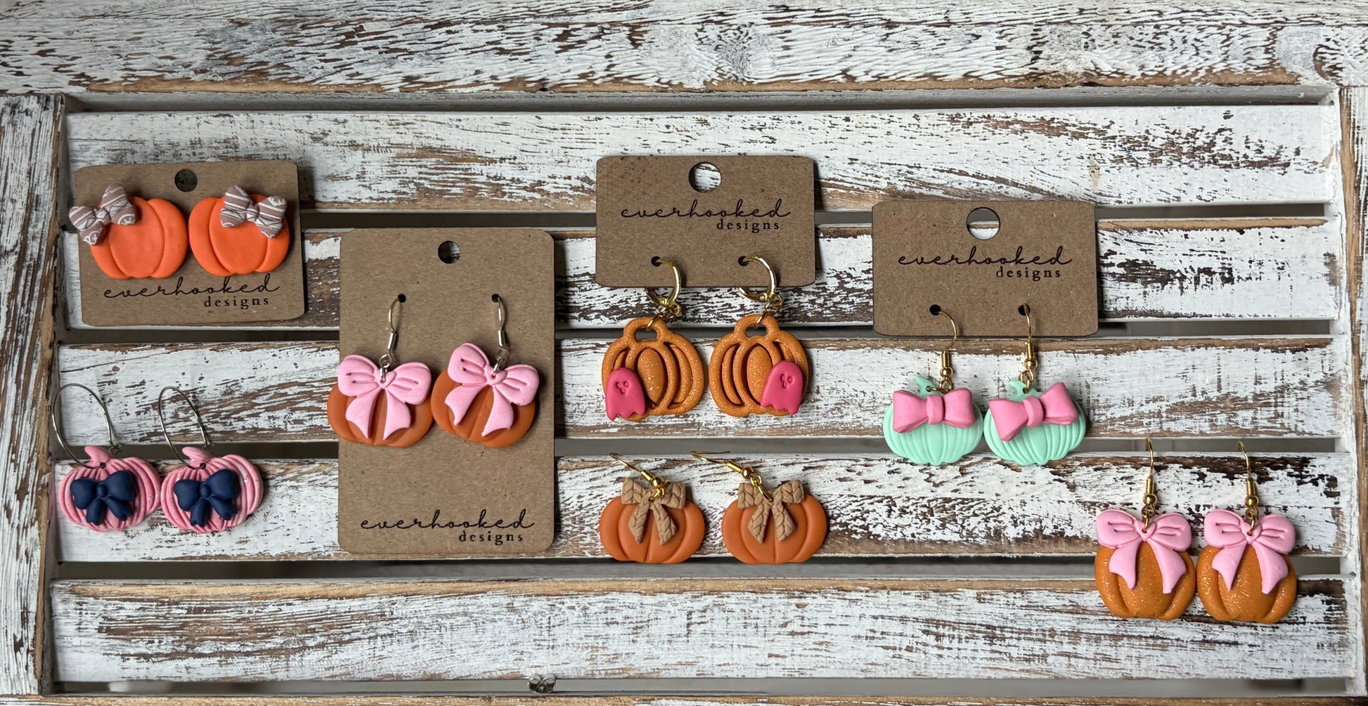 Handmade polymer clay pumpkin earrings in assorted fall styles, including orange, pink, and mint pumpkins with bows and classic designs, lightweight autumn jewelry by Everhooked
