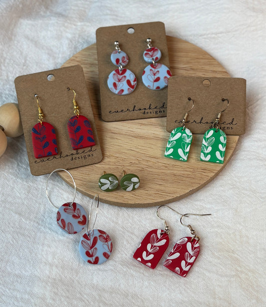 Collection of Floral Painted Clay earrings in a variety of colors and designs.