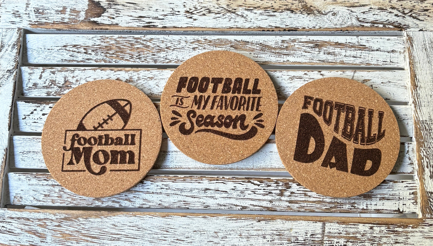 Handmade cork football coasters with engraved designs: Football Mom, Football Dad, and Football is My Favorite Season