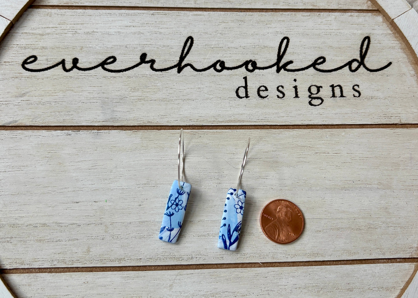 Square Dangle Earrings with Blue Floral Design compare size with penny