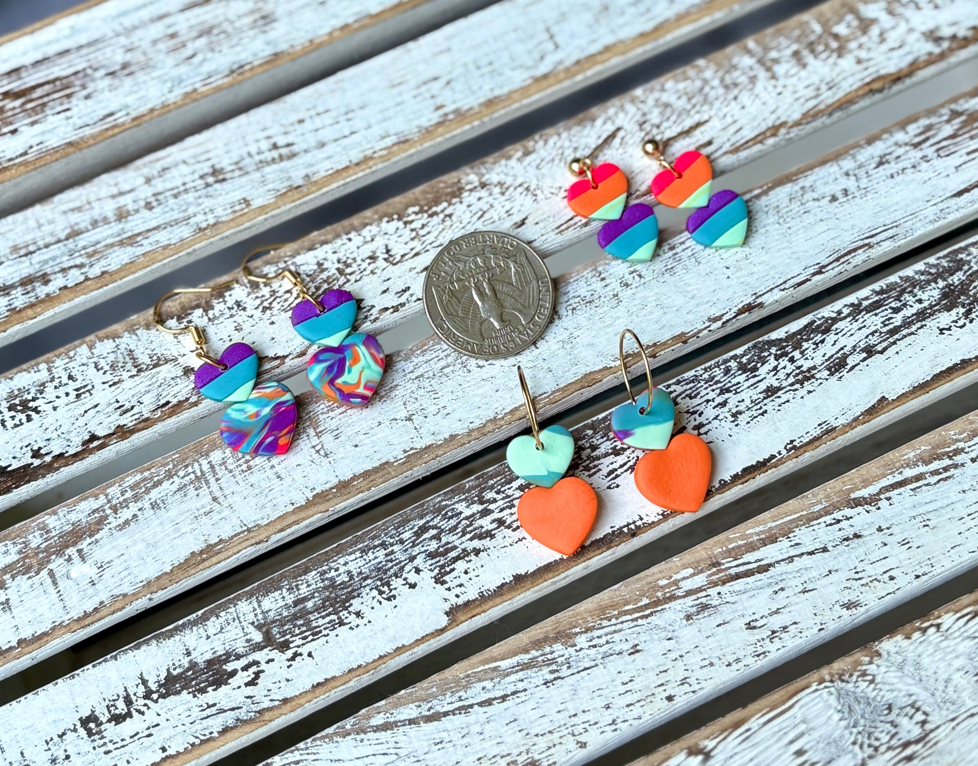 Color splash circle earrings and smiley face clay flowers in vibrant rainbow tones