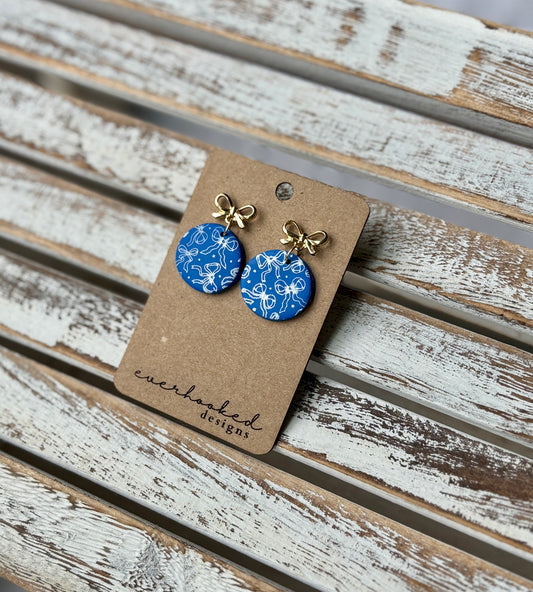 Round Blue earrings with bow design and gold bow hardware